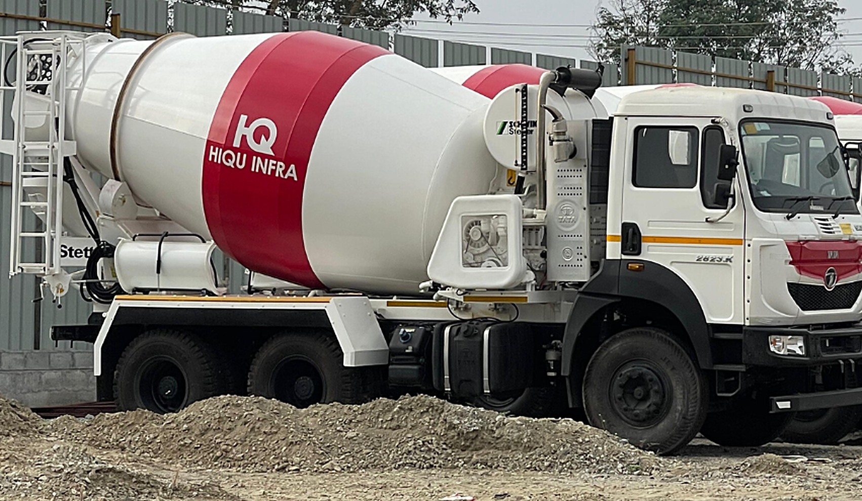 A HiQu Infra transit mixer truck at a construction site